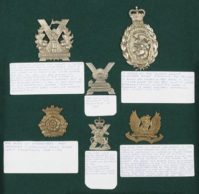 Lot 50 - Cap Badges. A nicely presented collection of military cap badges