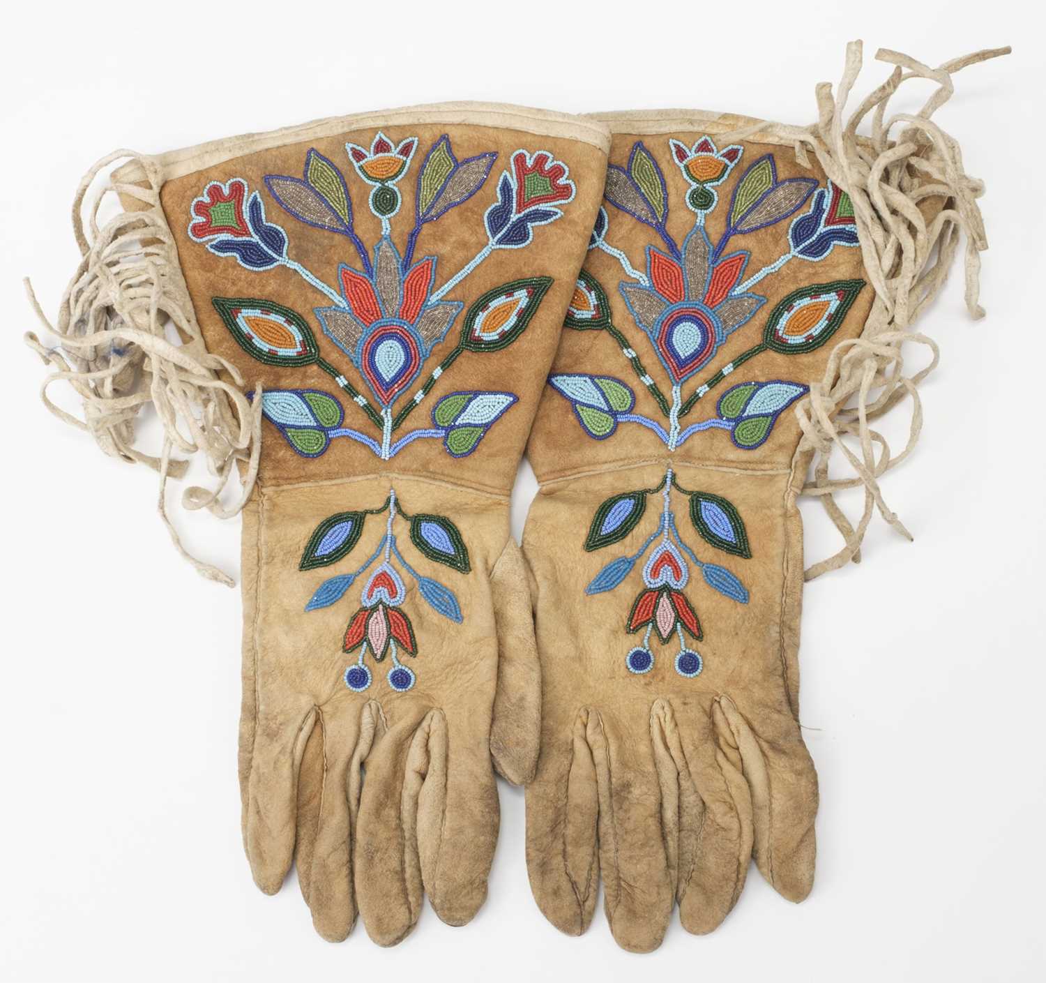 Lot 530 - Clothing. A pair of Native American beaded gloves, early 20th century