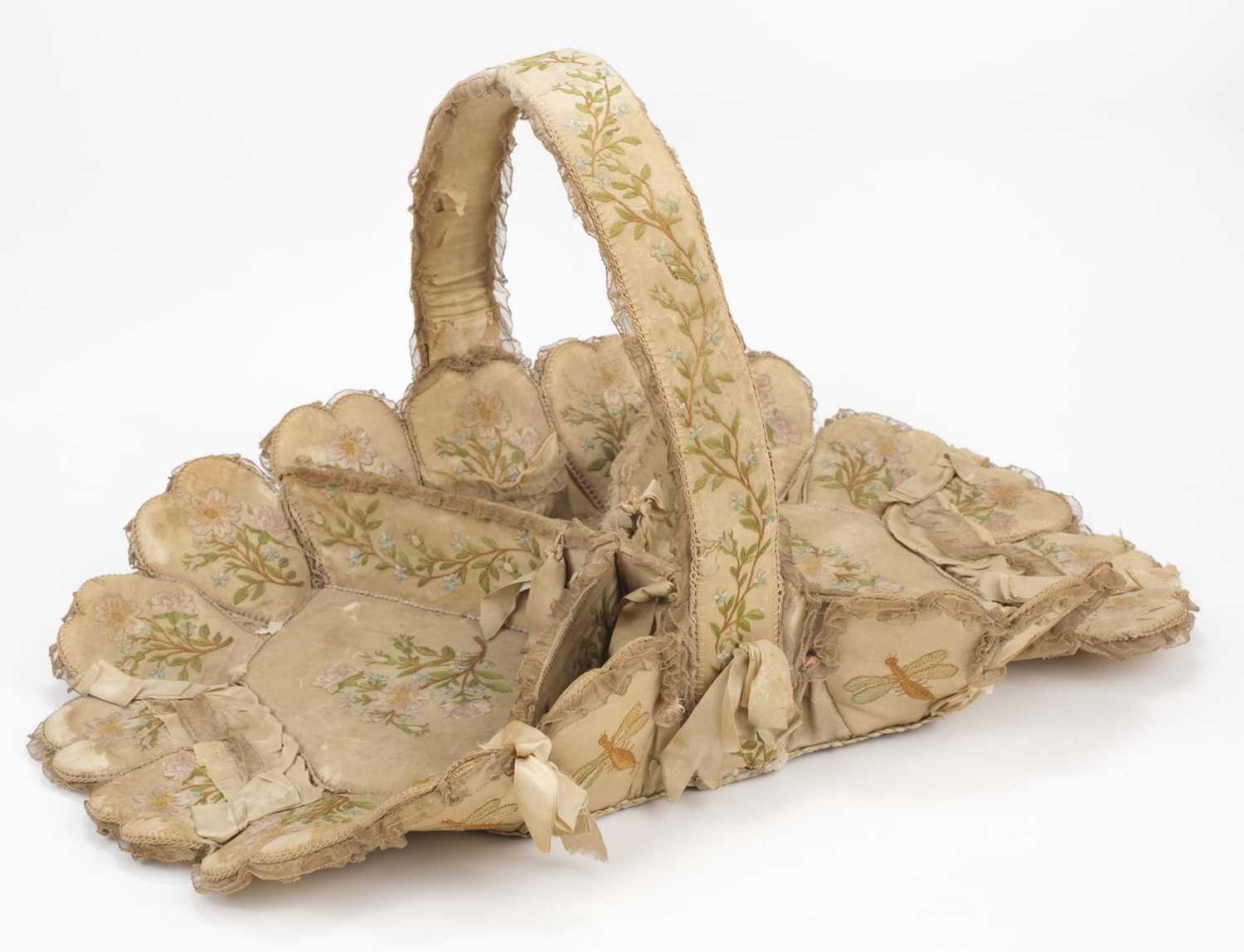 Lot 537 - Embroidered Basket. A Regency layette basket, early 19th century