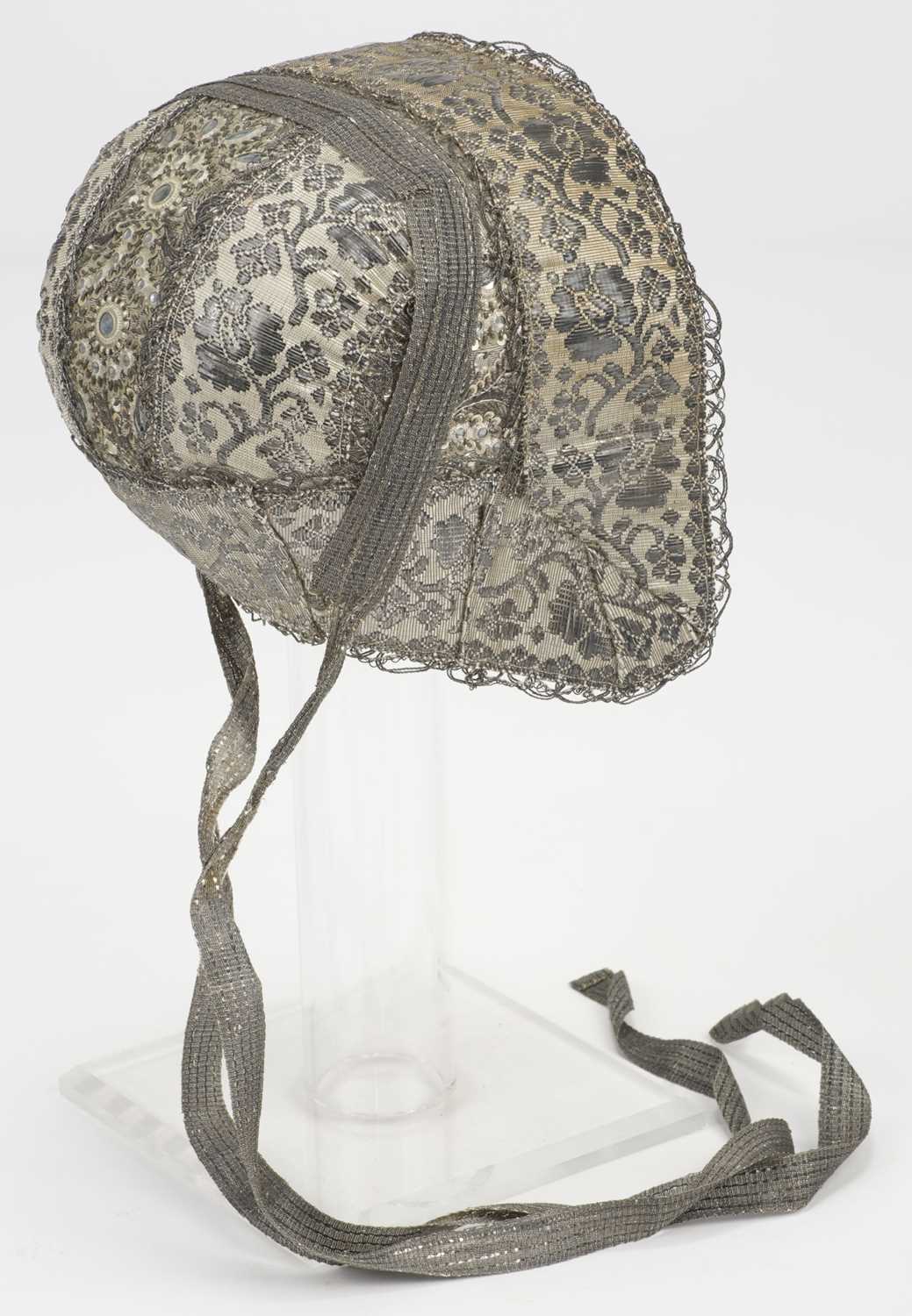 Lot 524 - Clothing. A child's silver bonnet, Northern Germany, early-mid 19th century