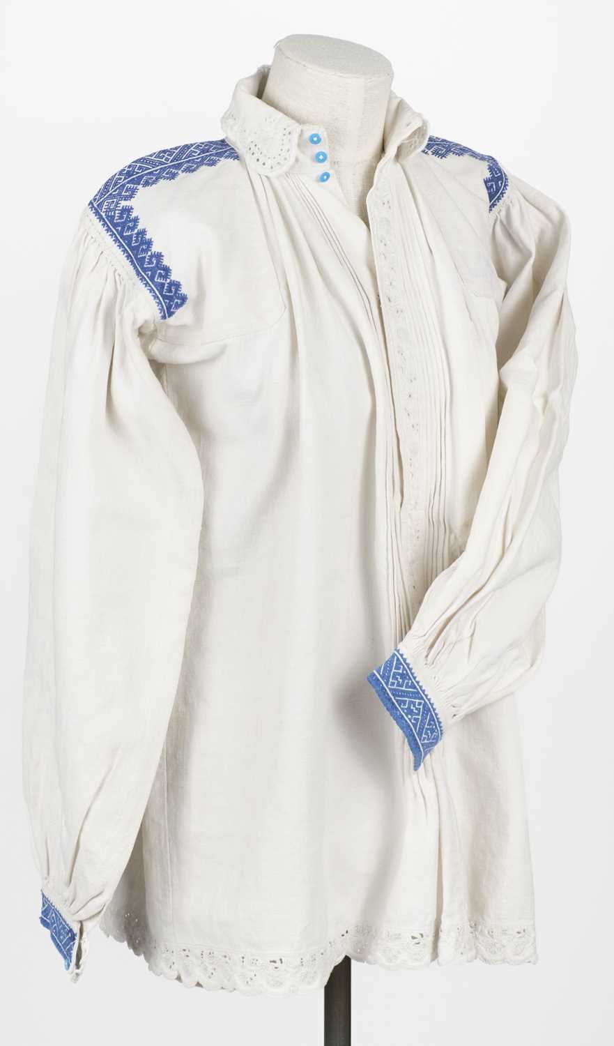 Lot 534 - Clothing. A Ukrainian linen smock, early 20th century, & other items