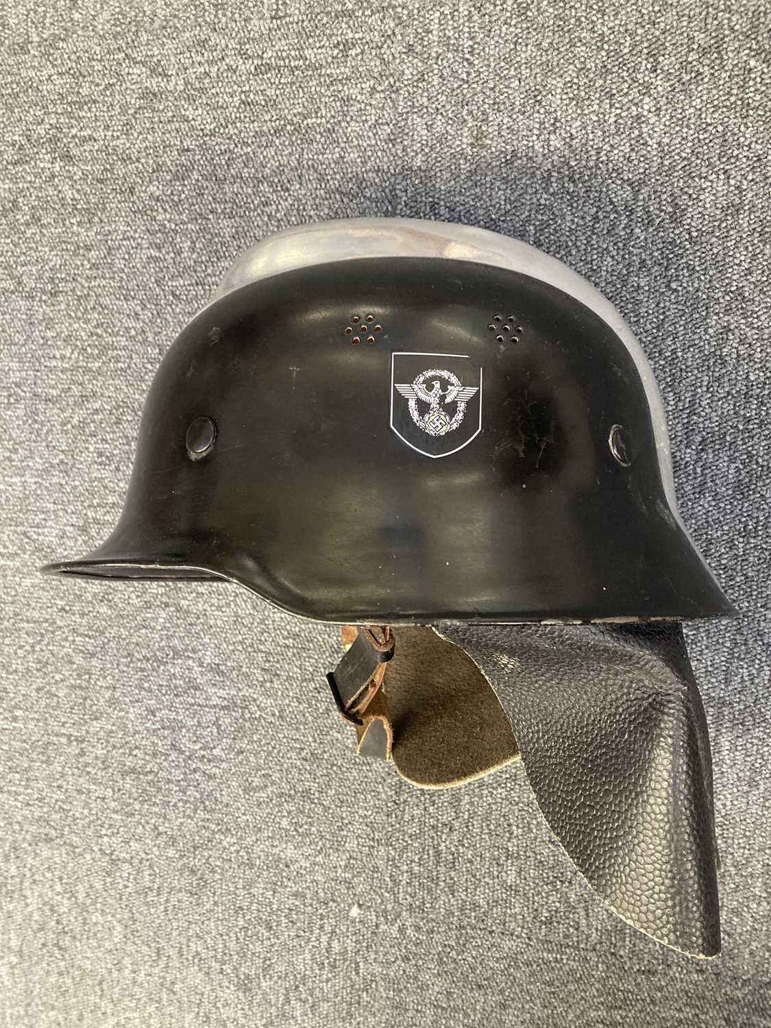 Lot 234 - Helmet. A refurbished WWII German fireman's helmet