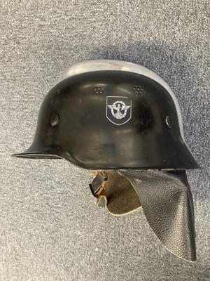 Lot 234 - Helmet. A refurbished WWII German fireman's helmet