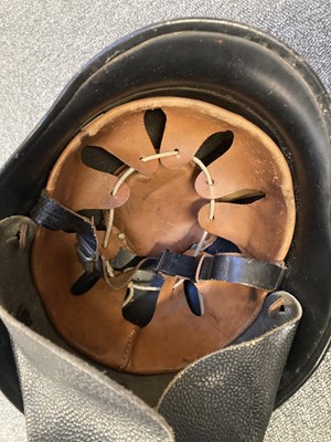 Lot 234 - Helmet. A refurbished WWII German fireman's helmet