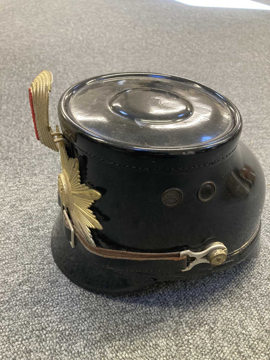 Lot 235 - Helmet. A West German Police shako by Friedrich Becker & Co, Berlin