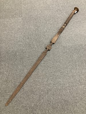 Lot 269 - Tribal Art. An African [?] two handle iron ceremonial sword, 19th century