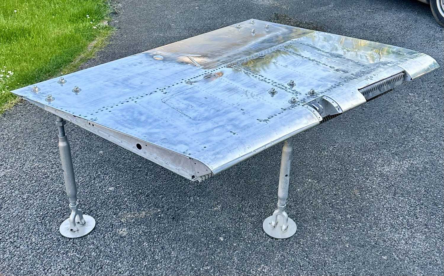 Lot 408 - F-4 Phantom Jet. A table made from an F-4 Phantom wing flap