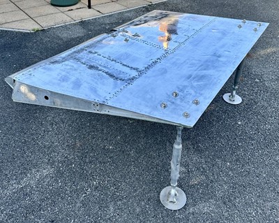 Lot 408 - F-4 Phantom Jet. A table made from an F-4 Phantom wing flap
