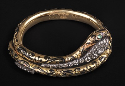 Lot 628 - Snake bracelet. An Edwardian bracelet formed as a serpent, reputedly belonging to Queen Alexandra