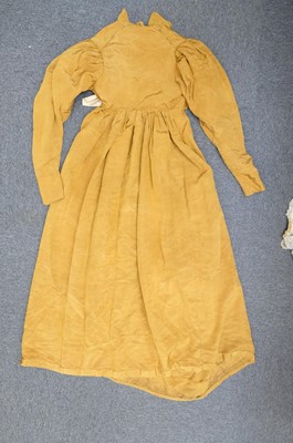 Lot 423 - Clothing. A gold moiré silk maternity gown, circa 1820s