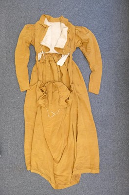Lot 423 - Clothing. A gold moiré silk maternity gown, circa 1820s