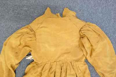 Lot 423 - Clothing. A gold moiré silk maternity gown, circa 1820s