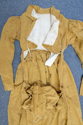 Lot 423 - Clothing. A gold moiré silk maternity gown, circa 1820s