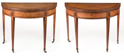 Lot 554 - Tables. A fine pair of George III satinwood demi-lune tables