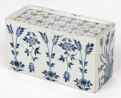 Lot 531 - Delft. An English delft blue and white flower brick, circa 1750