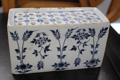 Lot 531 - Delft. An English delft blue and white flower brick, circa 1750