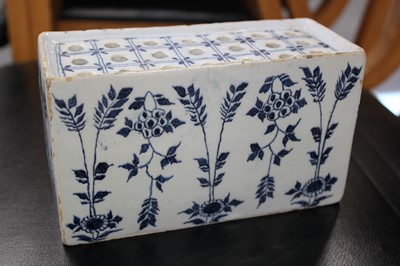 Lot 531 - Delft. An English delft blue and white flower brick, circa 1750
