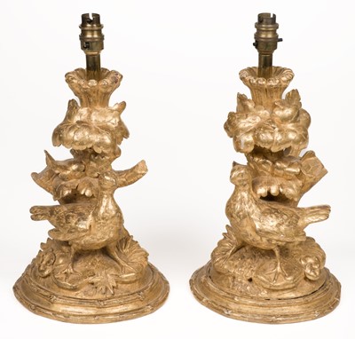 Lot 590 - Table lamps. A pair of giltwood carved table lamps, 19th century