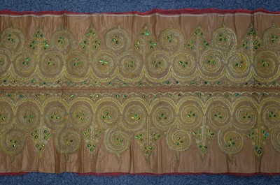 Lot 441 - Embroidery. A goldwork and beetle-wing panel, India, 19th century