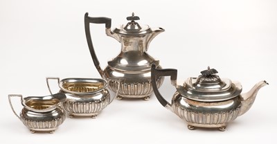 Lot 619 - Tea Service. A George V period four-piece silver tea service by Walker and Hall, Sheffield 1916