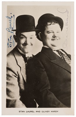 Lot 296 - Laurel (Stan, 1890-1965) & Hardy (Oliver, 1892-1957). Signed photographic publicity postcard