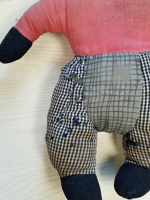 Lot 131 - Gollywog. An early 19th century gollywog, with card inscribed by Beatrix Potter, 1902