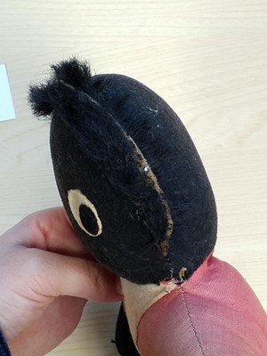 Lot 131 - Gollywog. An early 19th century gollywog, with card inscribed by Beatrix Potter, 1902