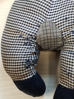 Lot 131 - Gollywog. An early 19th century gollywog, with card inscribed by Beatrix Potter, 1902