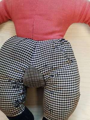 Lot 131 - Gollywog. An early 19th century gollywog, with card inscribed by Beatrix Potter, 1902