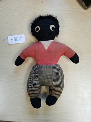 Lot 131 - Gollywog. An early 19th century gollywog, with card inscribed by Beatrix Potter, 1902