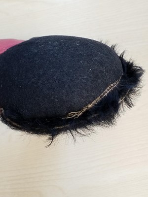 Lot 131 - Gollywog. An early 19th century gollywog, with card inscribed by Beatrix Potter, 1902