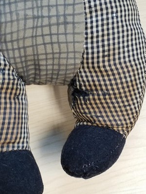 Lot 131 - Gollywog. An early 19th century gollywog, with card inscribed by Beatrix Potter, 1902