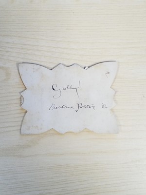 Lot 131 - Gollywog. An early 19th century gollywog, with card inscribed by Beatrix Potter, 1902