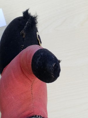 Lot 131 - Gollywog. An early 19th century gollywog, with card inscribed by Beatrix Potter, 1902