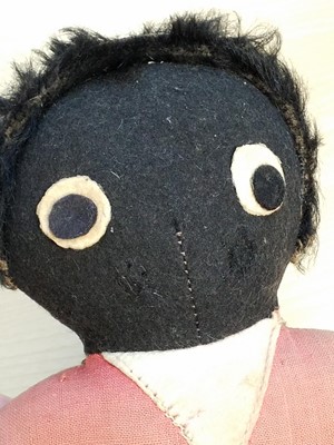 Lot 131 - Gollywog. An early 19th century gollywog, with card inscribed by Beatrix Potter, 1902