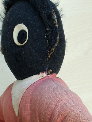 Lot 131 - Gollywog. An early 19th century gollywog, with card inscribed by Beatrix Potter, 1902