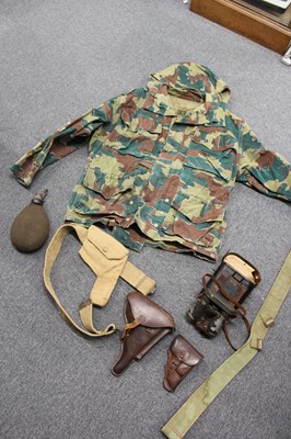 Lot 258 - Army surplus. A WWII German water bottle, holsters and other items