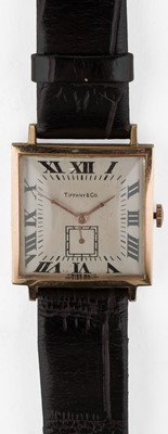 Lot 689 - Tiffany & Co. An art deco square-form tank watch by Tiffany & Co., circa 1940