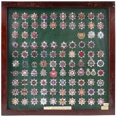 Lot 188 - Fire Fighting. 196 British fire brigade cap badges, framed