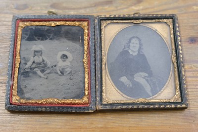 Lot 27 - Cased Images. A group of fourteen family portraits, c. 1860s