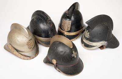 Lot 184 - Fire Fighting. A collection of Continental fireman's helmets, circa 1900