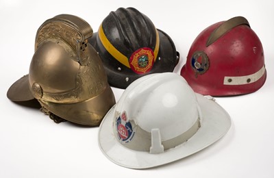 Lot 178 - Fire Fighting. A collection of World fireman's helmets