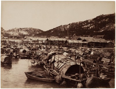 Lot 55 - Hong Kong. A collection of sampans on the water with dwellings and hills behind, circa 1890s
