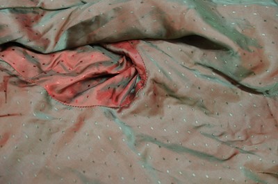 Lot 457 - Chinoiserie. A beaded gold lamé coat, 1920s