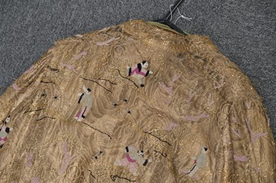 Lot 457 - Chinoiserie. A beaded gold lamé coat, 1920s