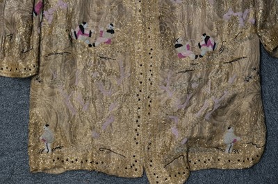 Lot 457 - Chinoiserie. A beaded gold lamé coat, 1920s