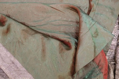 Lot 457 - Chinoiserie. A beaded gold lamé coat, 1920s