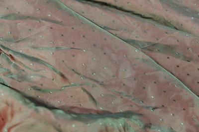 Lot 457 - Chinoiserie. A beaded gold lamé coat, 1920s