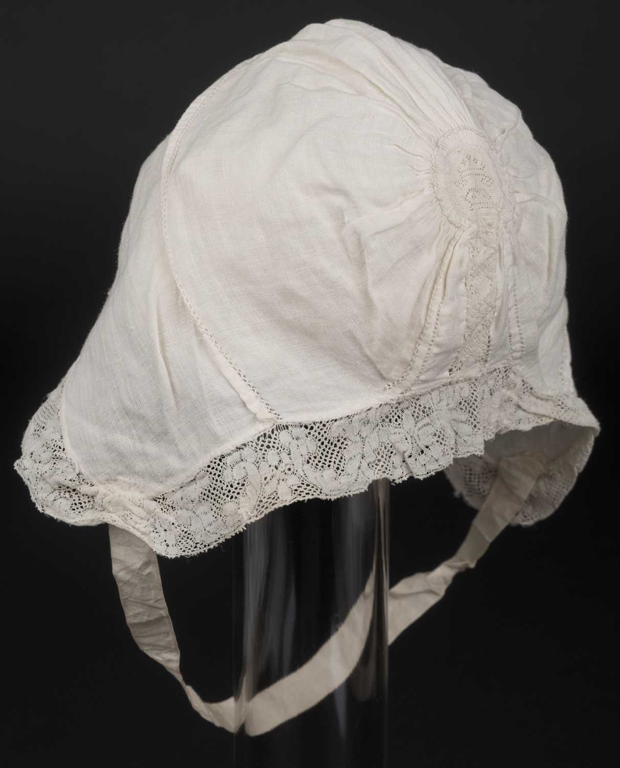 Lot 449 - Children's Clothing. A hollie point lace baby bonnet, late 18th century, & other garments