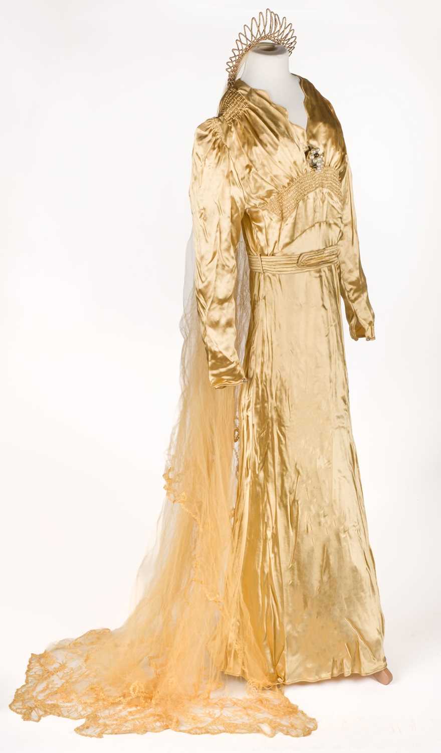Lot 462 - Clothing. A gold satin wedding dress worn by Olive Mary Bankes, 1938